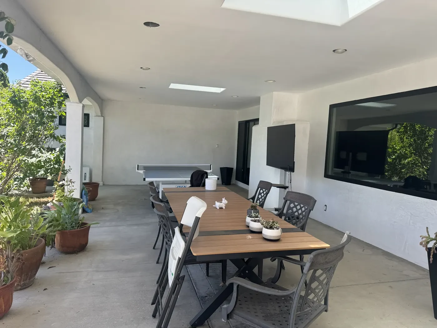 Plants and comfortable seating in the restored outdoor living space