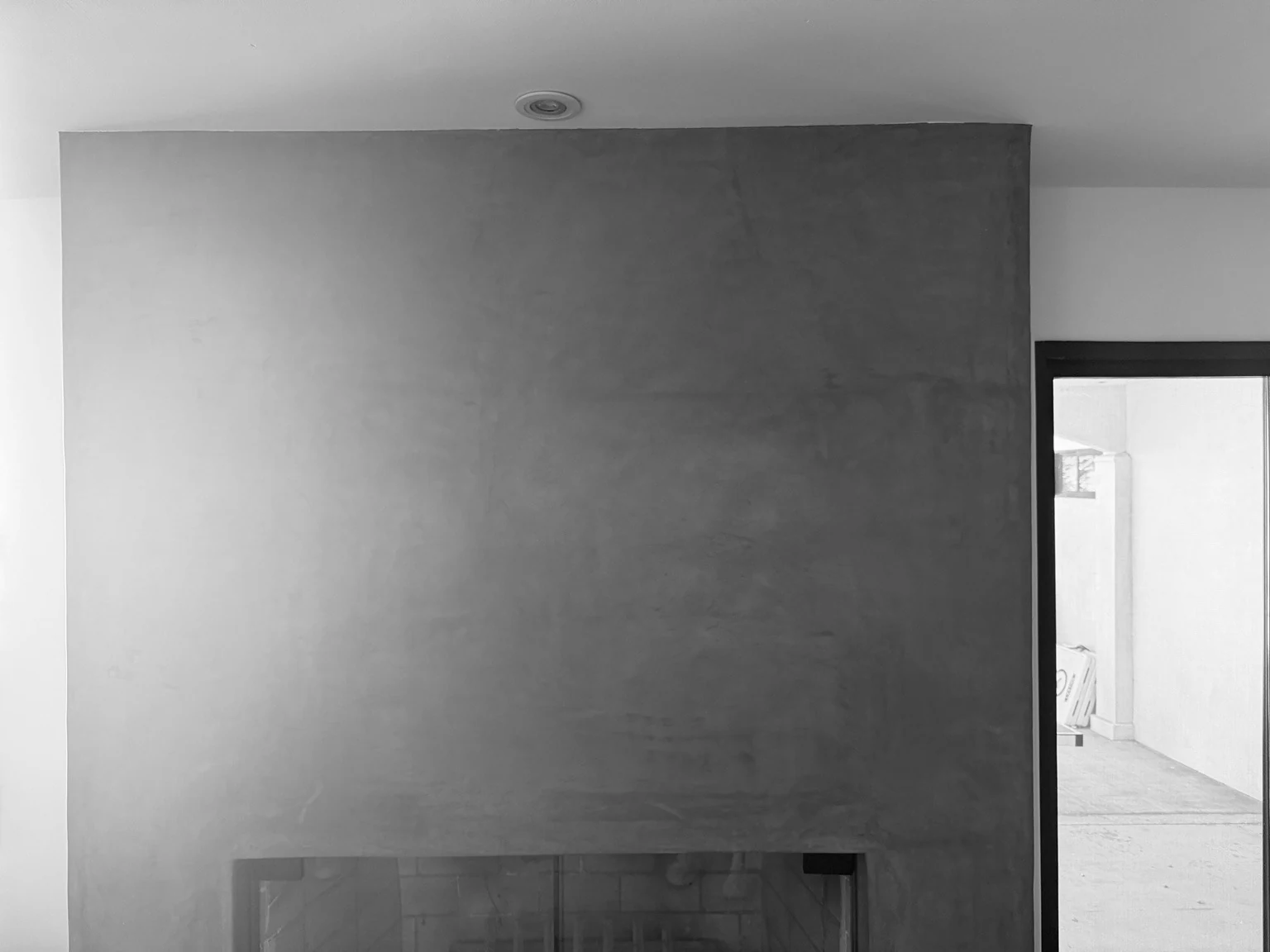 Finished interior fireplace wall and doorway