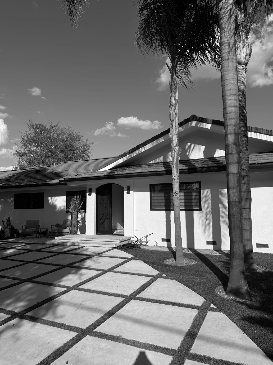 Restored entrance, driveway and palm trees
